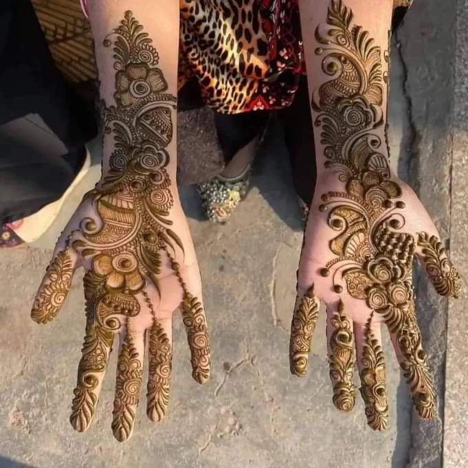 Bridal mehndi design featuring royal  peacock and lotus motifs, KR Puram